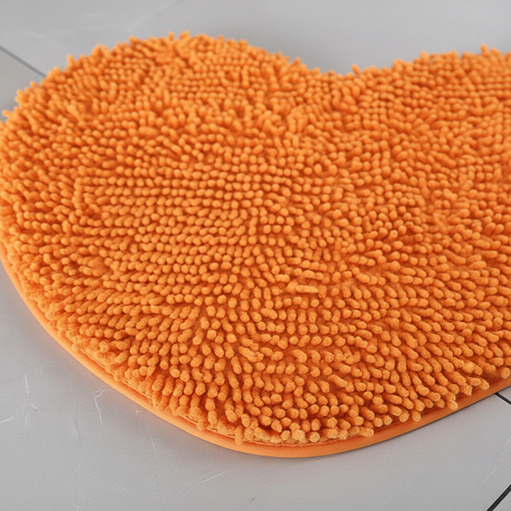 Plush chenille heart-shaped bath mat, perfect cute decor for any bathroom or home floor.
