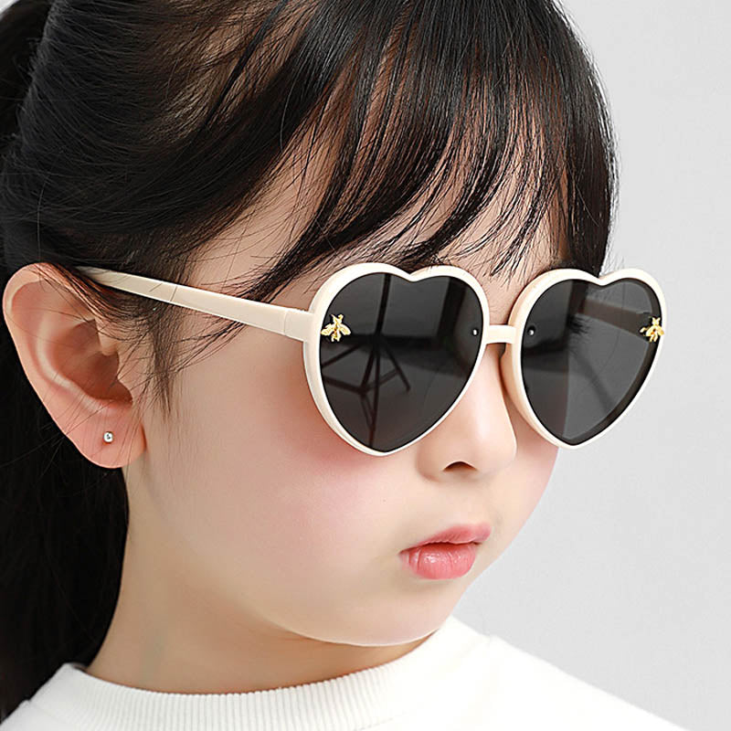Cute heart-shaped pink sunglasses for girls, offering UV protection, ideal for toddler fashion & summer fun