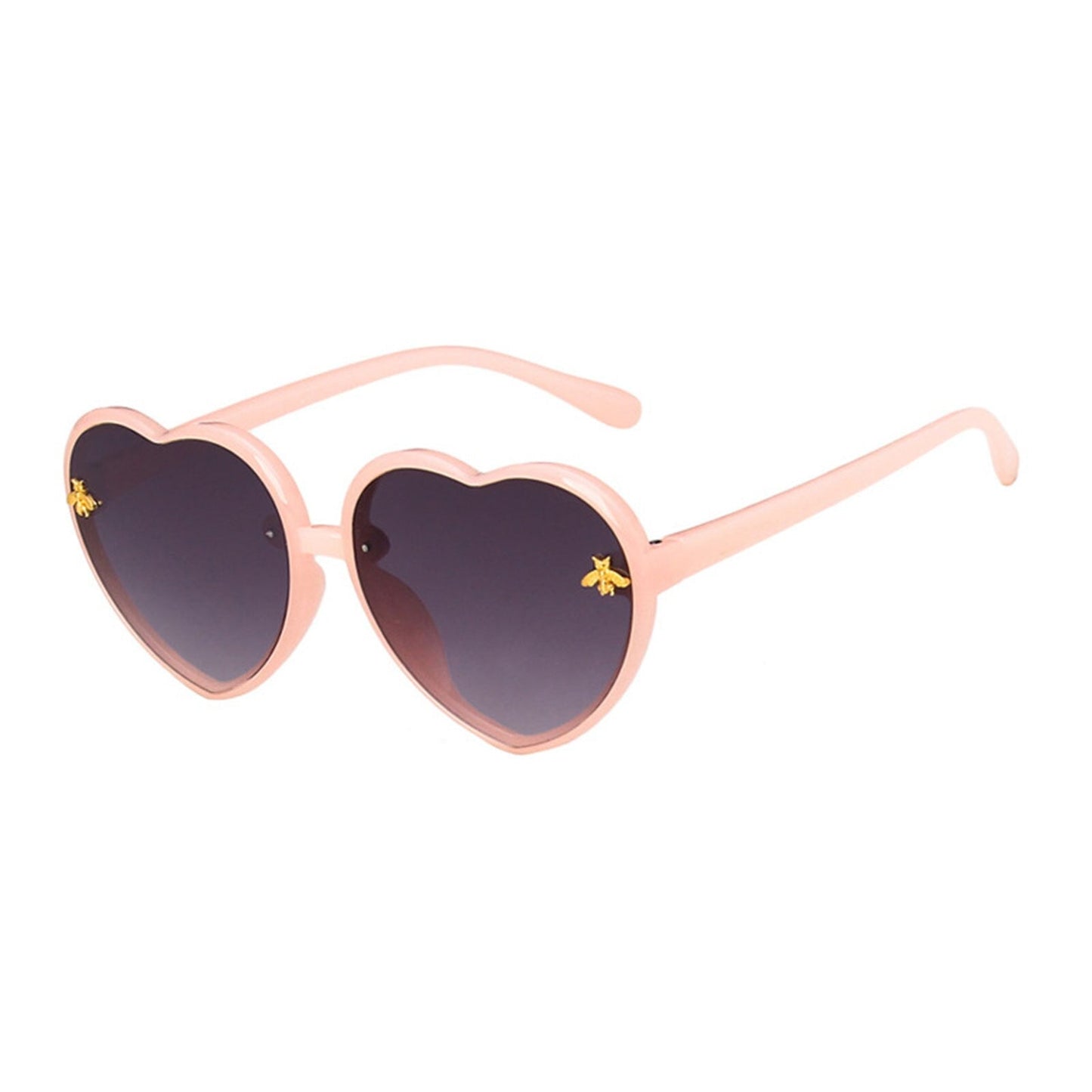 Child model playfully wearing heart-shaped green sunglasses, highlighting kids eyewear and summer essentials