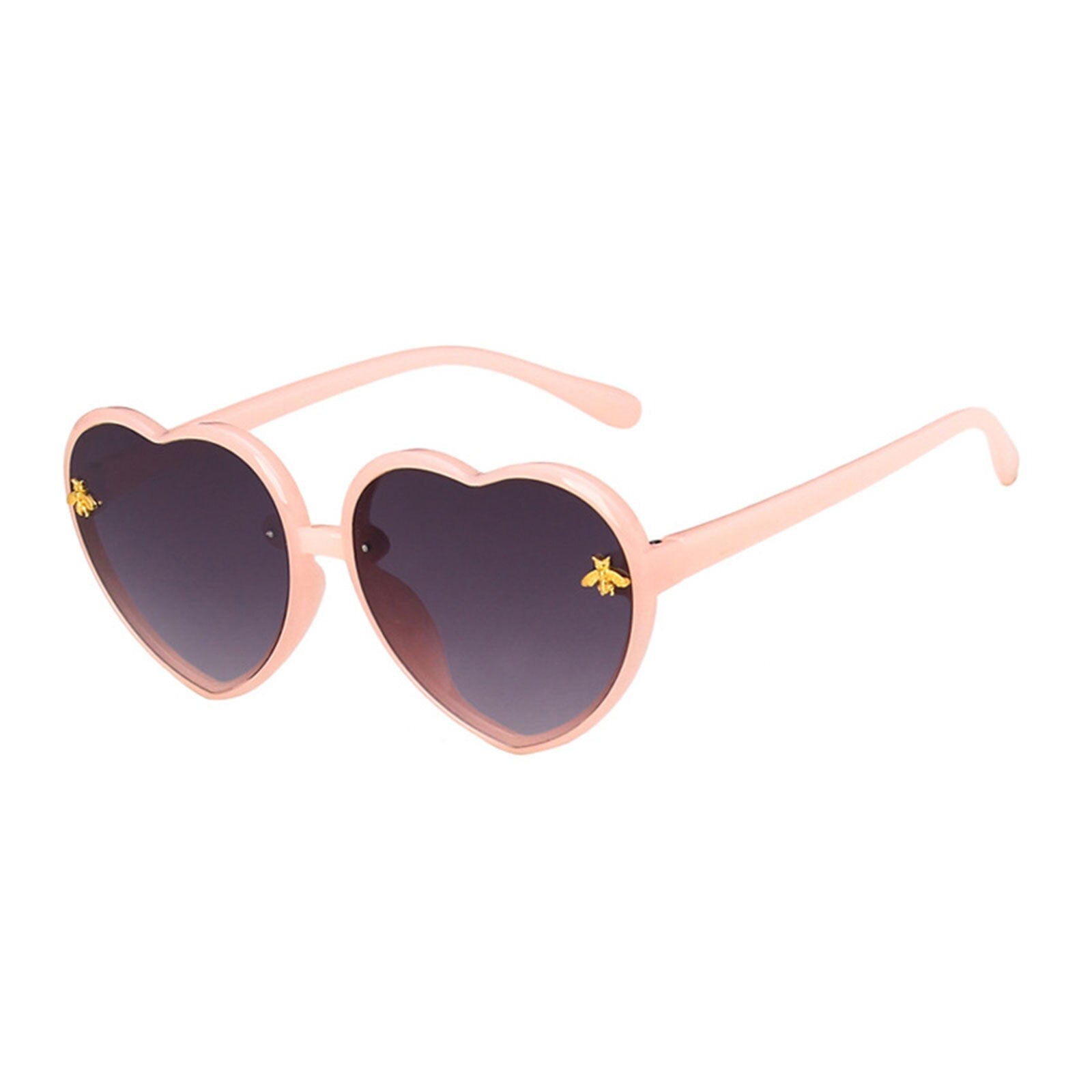 Child model playfully wearing heart-shaped green sunglasses, highlighting kids eyewear and summer essentials