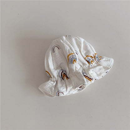 Baby wearing a stylish blue cotton beanie hat, an all-season kids' accessory and baby gift.