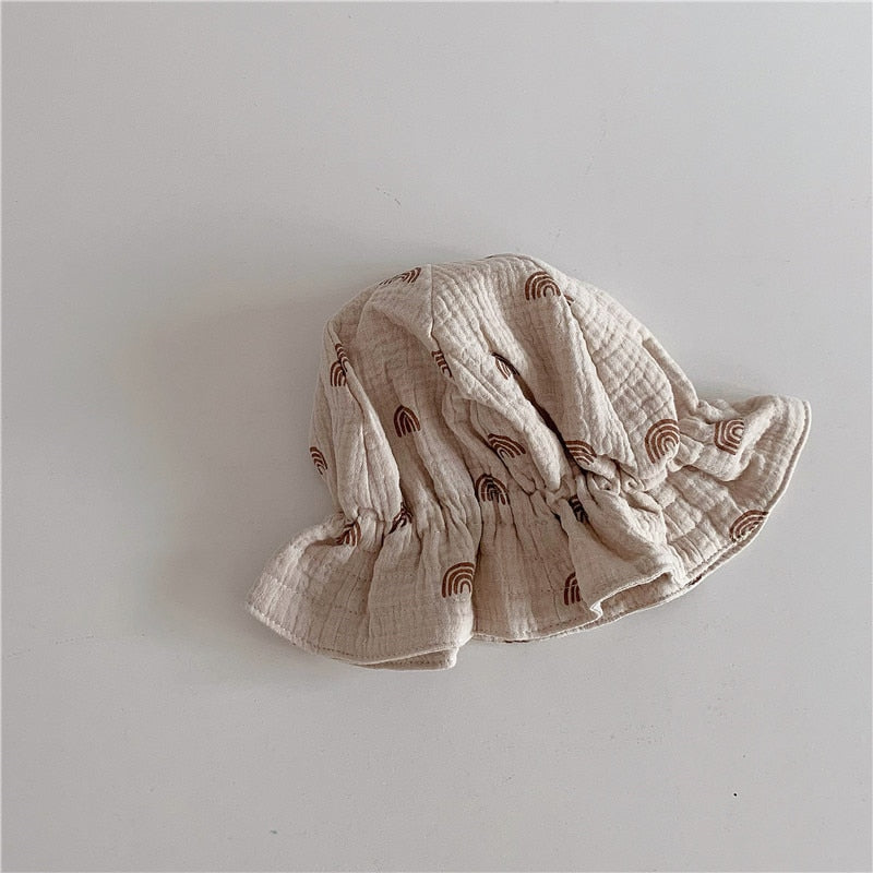 Collection of colorful baby cotton beanies, showing various shades for stylish baby accessories.
