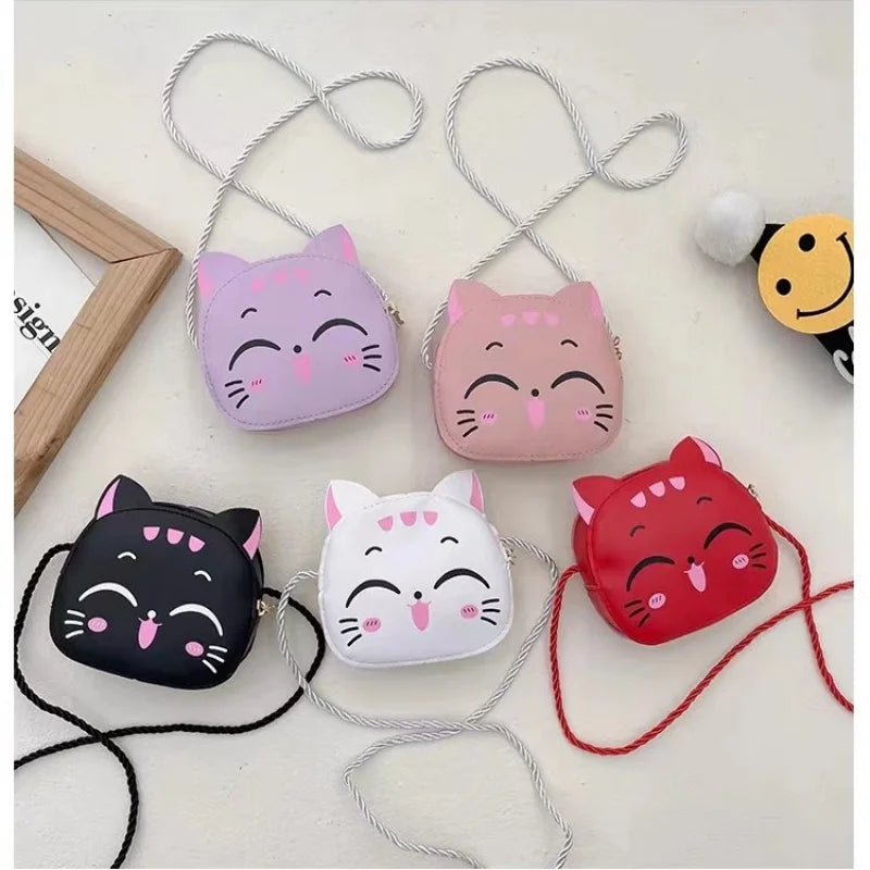 Pink cat-shaped kids' crossbody bag, a stylish coin pouch with an adjustable shoulder strap.