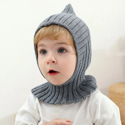 Cute knitted baby winter hat in a neutral color, perfect for newborns and toddlers, unisex design.