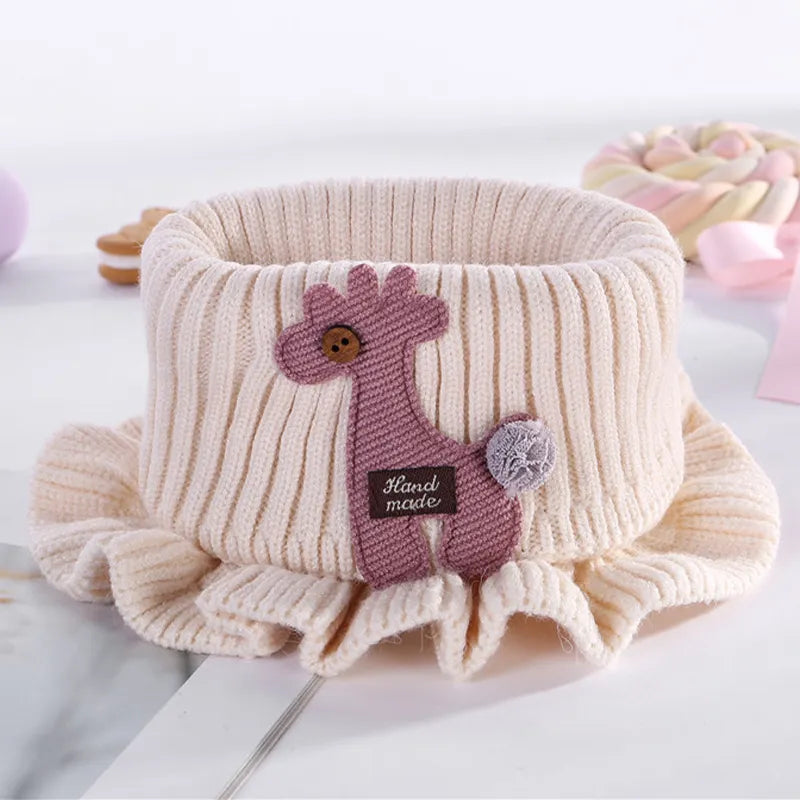 Cute knitted giraffe scarf, a cozy baby accessory designed for warmth and style.