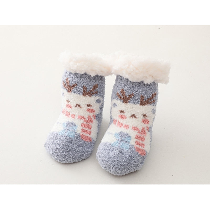 Close-up of anti-slip grippers on the sole of white baby thick cotton socks, for active infants.