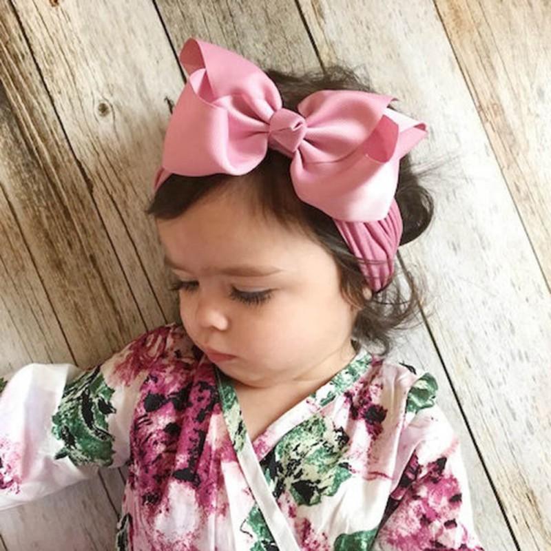 White soft bow headband for infants, comfortable hair accessory for baby girls