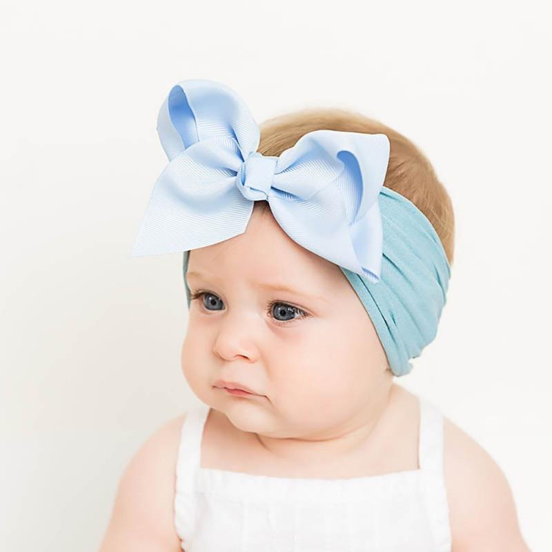 Red soft bow headband for baby girls, adorable hair accessory, comfortable infant wear