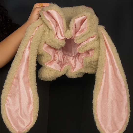 Warm pink bunny bonnet hat for women, soft headwear perfect for sleep, lounge, and winter.