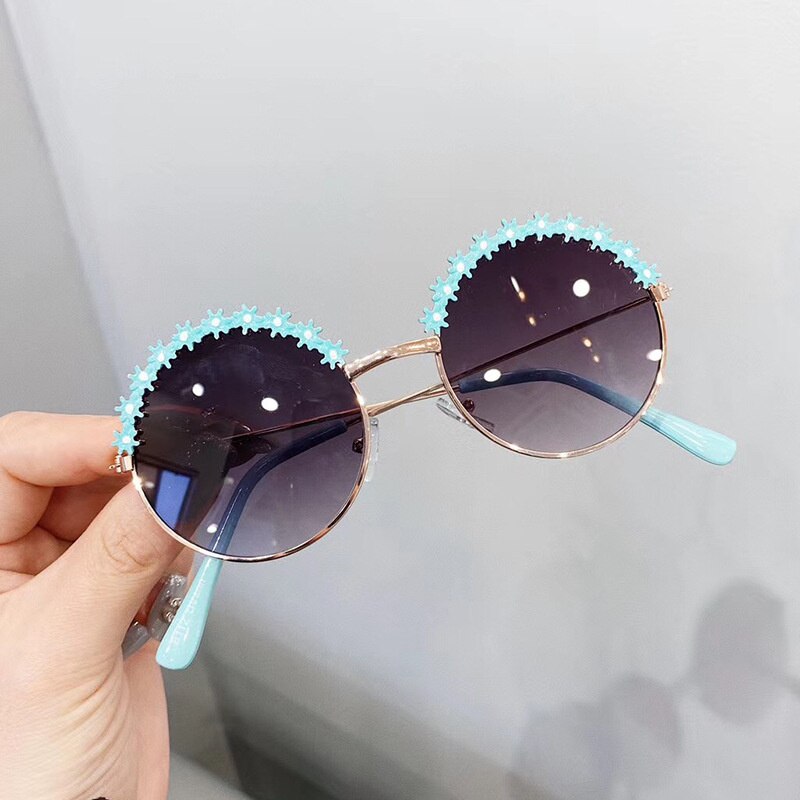 Flexible orange frames on UV protection kids sunglasses, safe for rough-and-tumble play