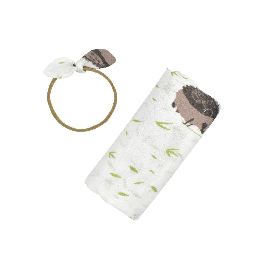 Ultra-soft cotton newborn baby swaddle wrap & headband set. Ensures infant comfort. Versatile baby accessory.