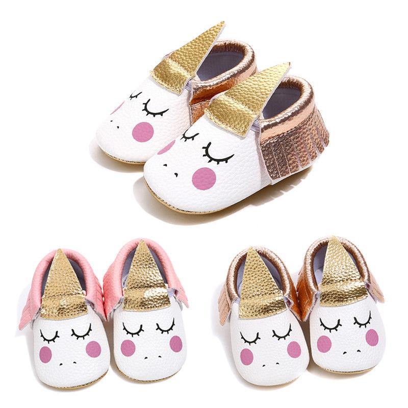 Pair of colorful unicorn baby girl shoes, designed with non-slip bottoms for safe infant play.