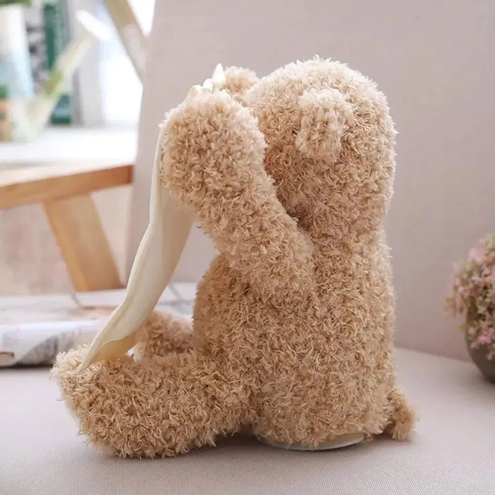 Interactive peekaboo bear plush toy with moving arms and sound for engaging child's play.