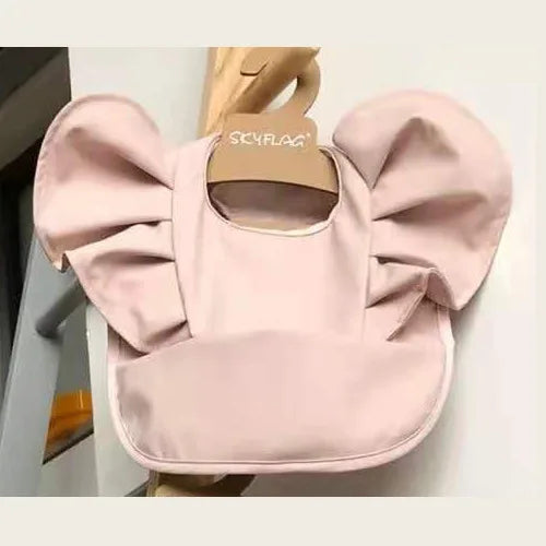 Pink waterproof baby bib for infants and toddlers with integrated food catching pocket, easy to wipe
