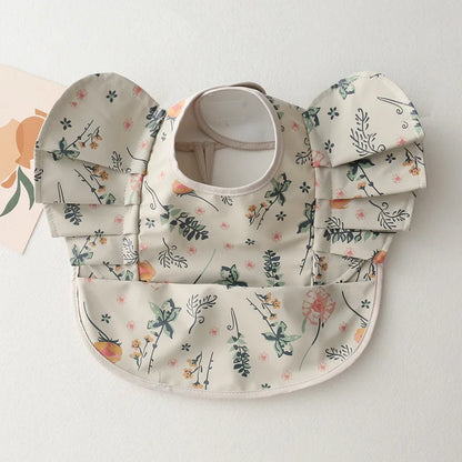 Back view of an adjustable baby infant waterproof bib showing the secure neck fastening for comfort