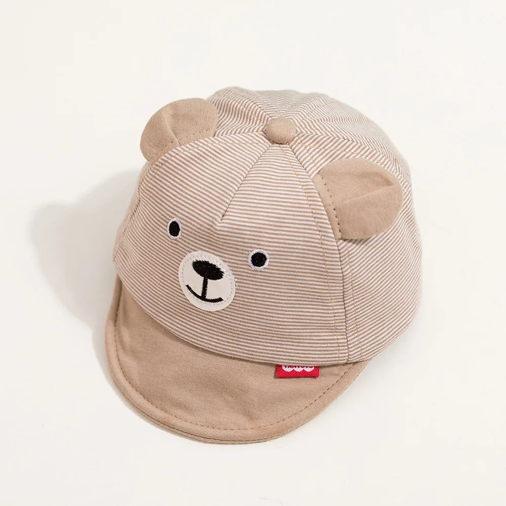 Stack of colorful cartoon baby caps, adjustable cotton for newborns and infants, unisex essentials