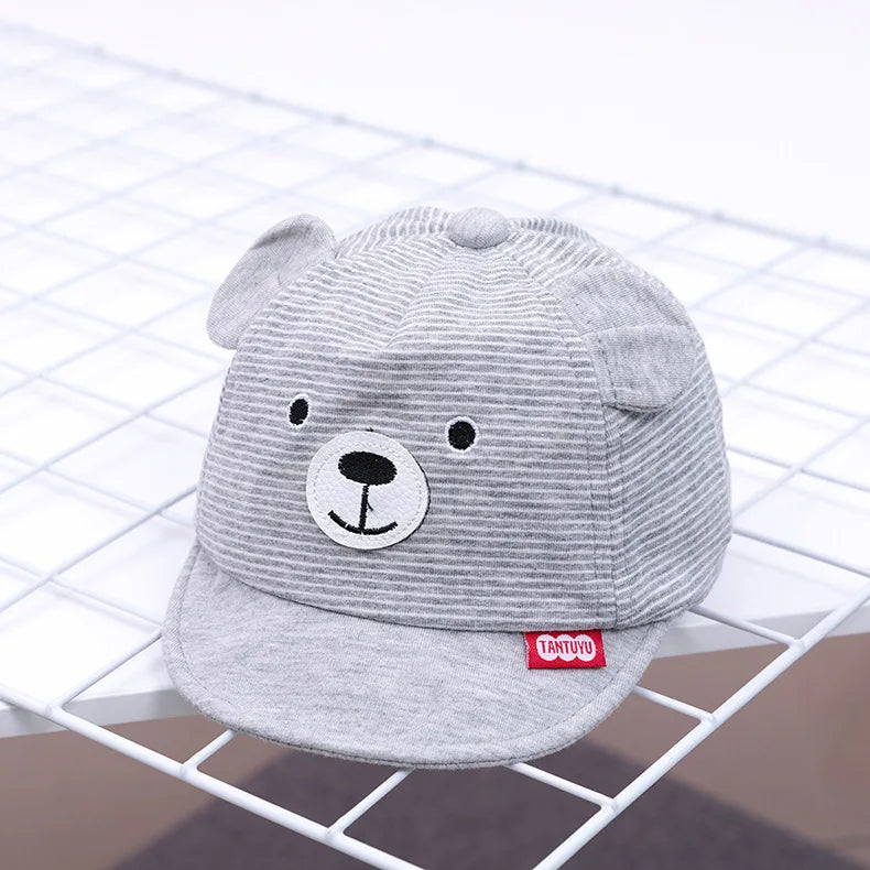 Soft cotton baby cap with a cute cartoon rabbit design, adjustable for newborn comfort