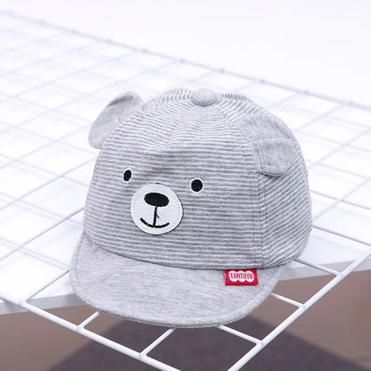 Soft cotton baby cap with a cute cartoon rabbit design, adjustable for newborn comfort