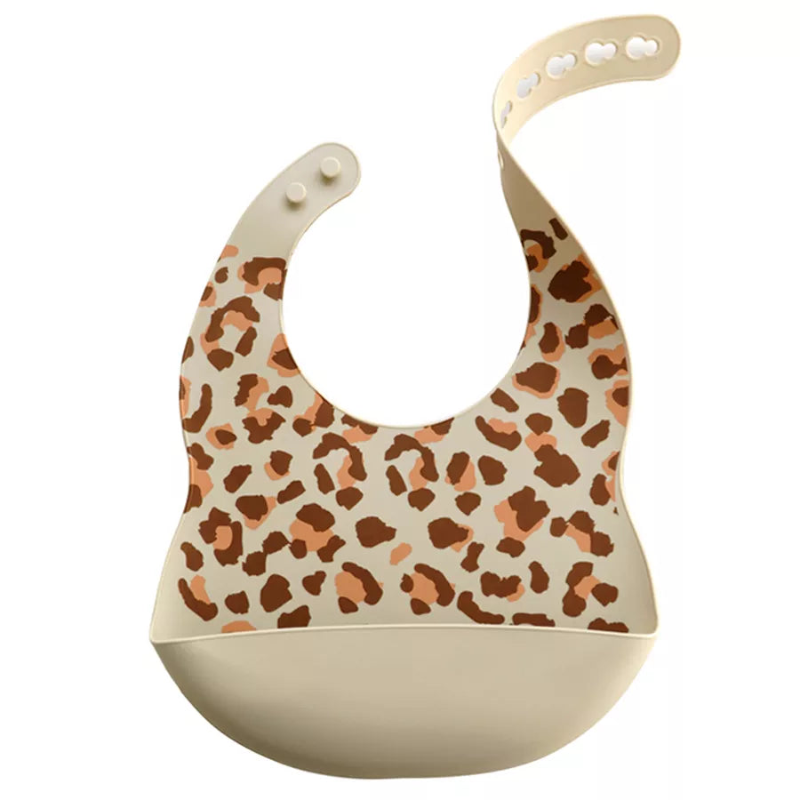 Ergonomic silicone baby bib with a cartoon dinosaur, ensures mess-free and stylish baby feeding