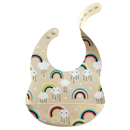Waterproof silicone baby bib in a bright blue with a friendly cartoon whale, for infant feeding