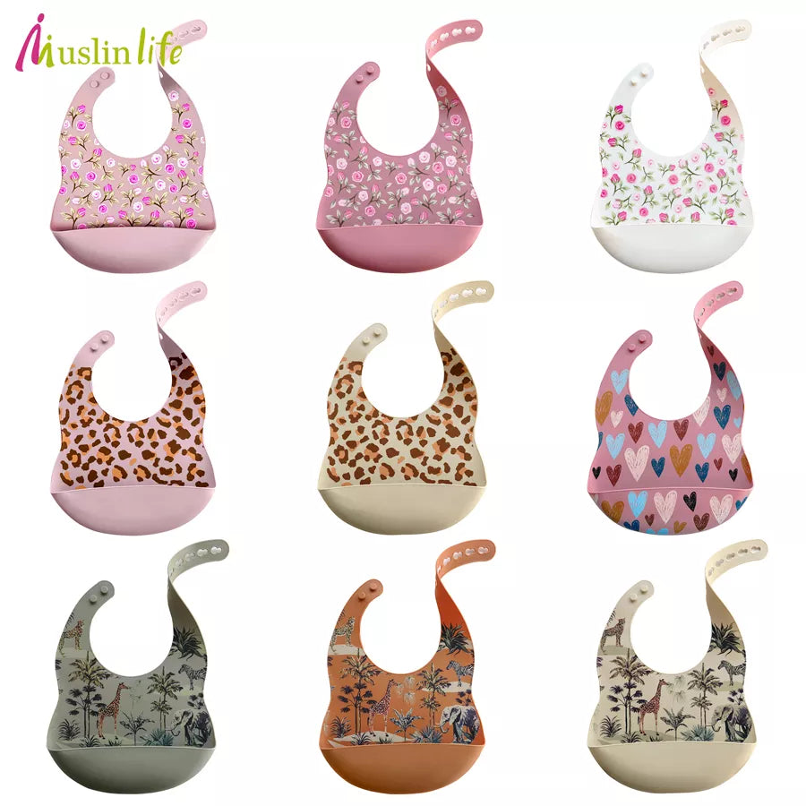 Waterproof silicone baby bib with playful cartoon elephant design, ideal for toddler mealtime