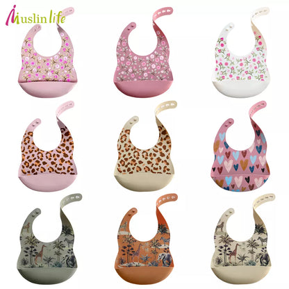 Waterproof silicone baby bib with playful cartoon elephant design, ideal for toddler mealtime