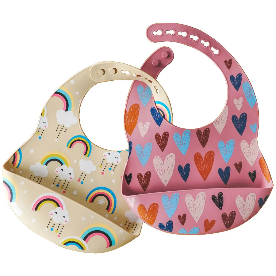 Adjustable silicone baby bib in a vibrant green with a happy cartoon frog, for infant feeding
