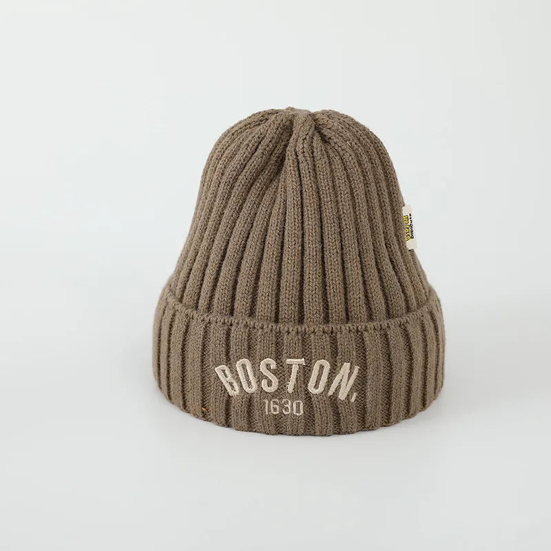 Red knitted infants' beanie with 'J' letter, a snugly addition to baby winter wear
