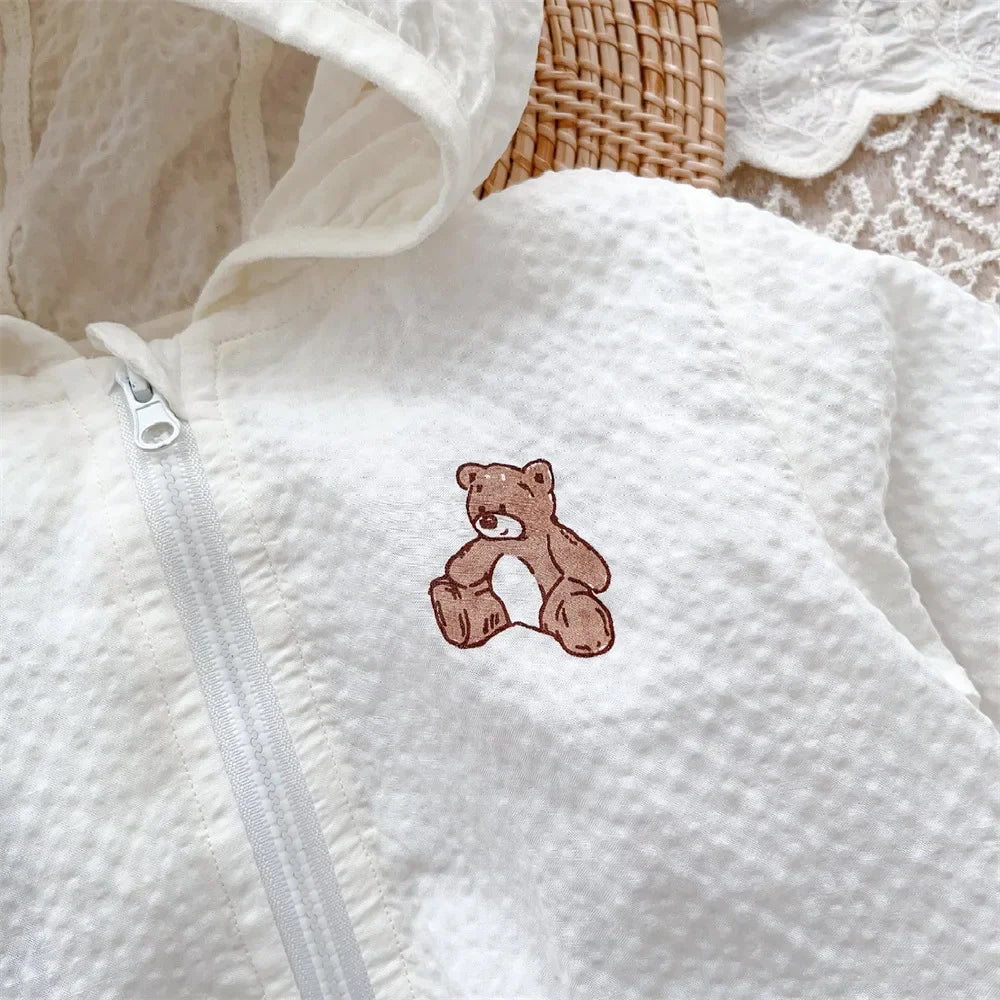 Pink infant outerwear with bear hood, UV protection, perfect for bright summer days