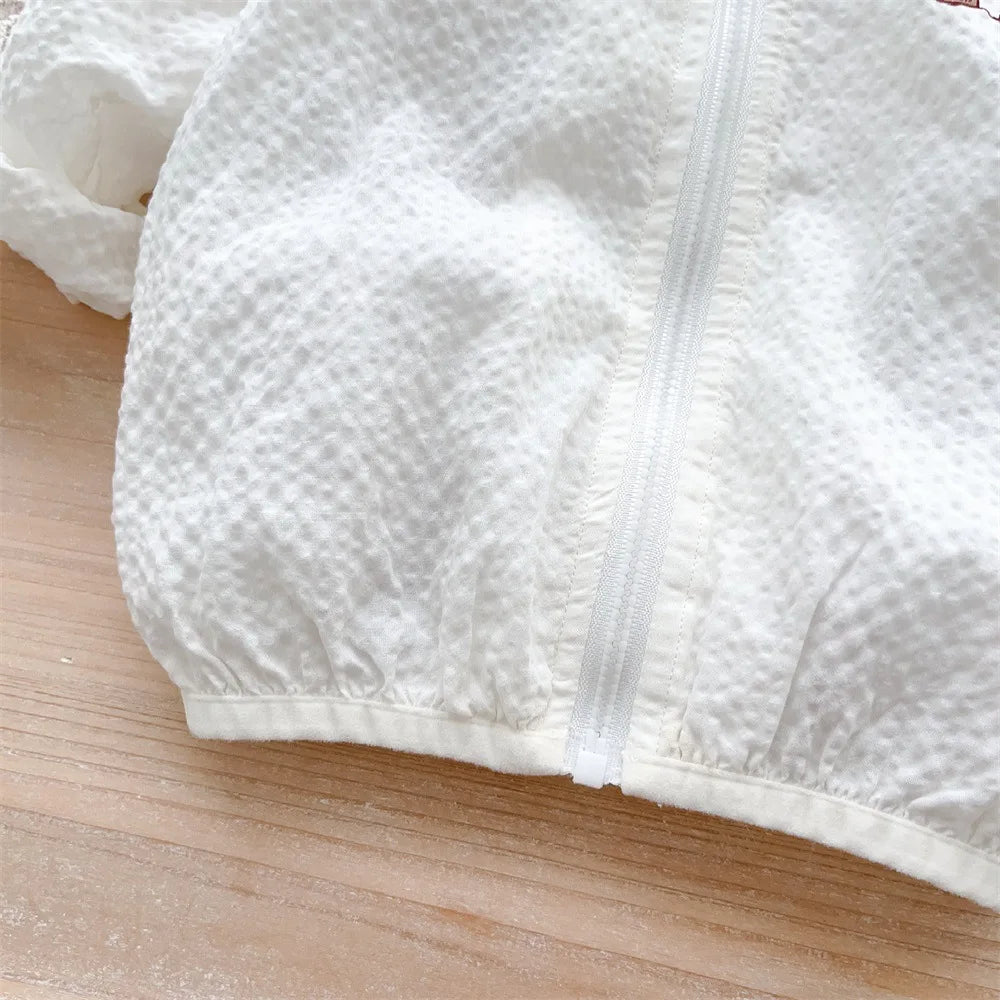 Breathable orange baby sun jacket, bear face, ideal for playful summer adventures