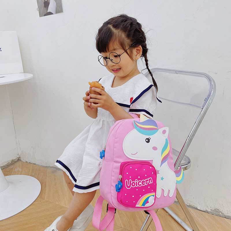 Group of cartoon animal kids backpacks: zebra, dino, giraffe, unicorn school bags, nylon.