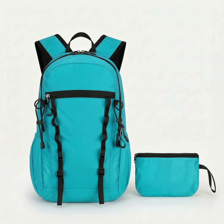 Portable cyan foldable backpack, perfect as a lightweight daypack for travel, hiking, and outdoor activities.