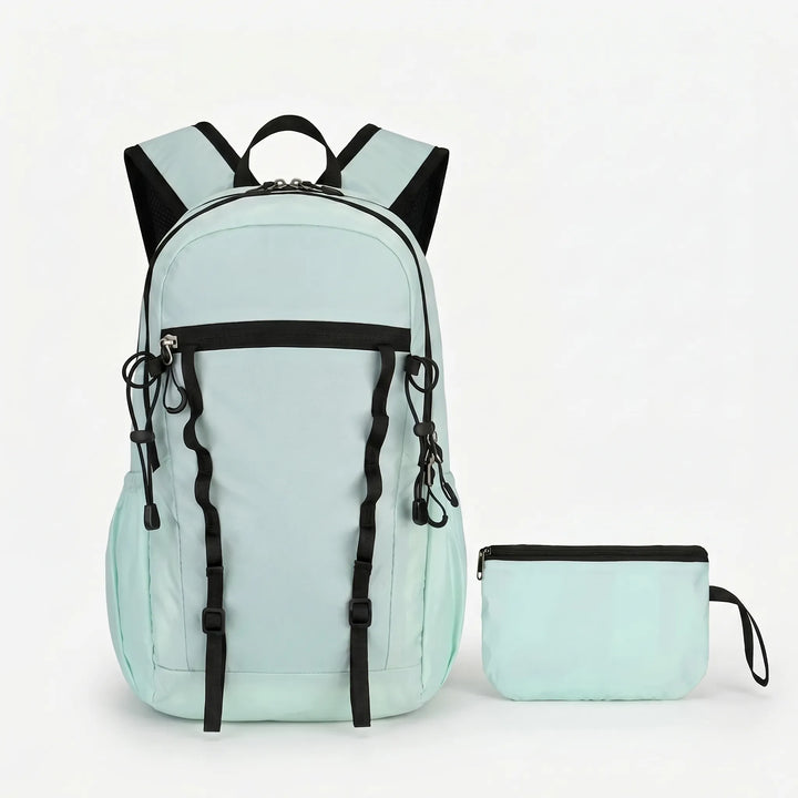 Versatile cyan foldable backpack, a lightweight daypack for hiking, urban travel, and outdoor use.