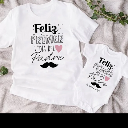 Stylish dad and baby in coordinated heart print short sleeve tops, family matching clothes