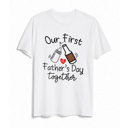 Flat lay of a 'First Father's Day' dad t-shirt and baby romper set. Matching clothes, unisex.