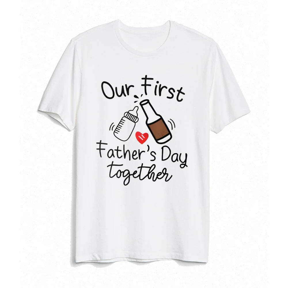 Father and child laughing, wearing their 'First Father's Day' matching clothes. Fathers Day gift idea.