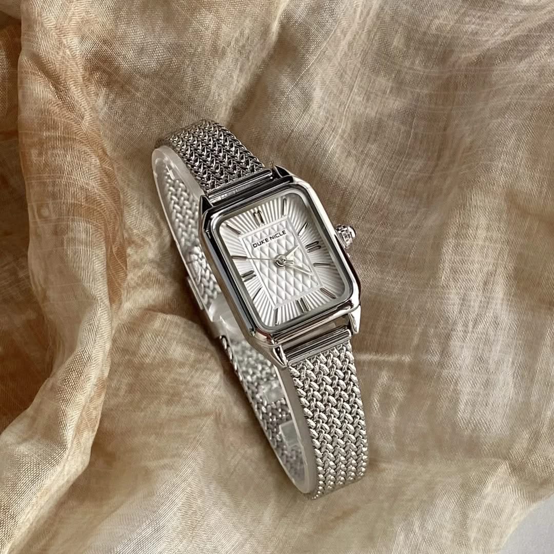 Dainty women's stainless steel timepiece, elegant and sleek fashion accessory.