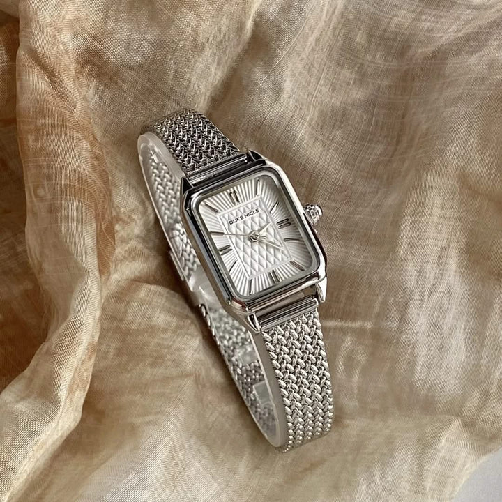Dainty women's stainless steel timepiece, elegant and sleek fashion accessory.