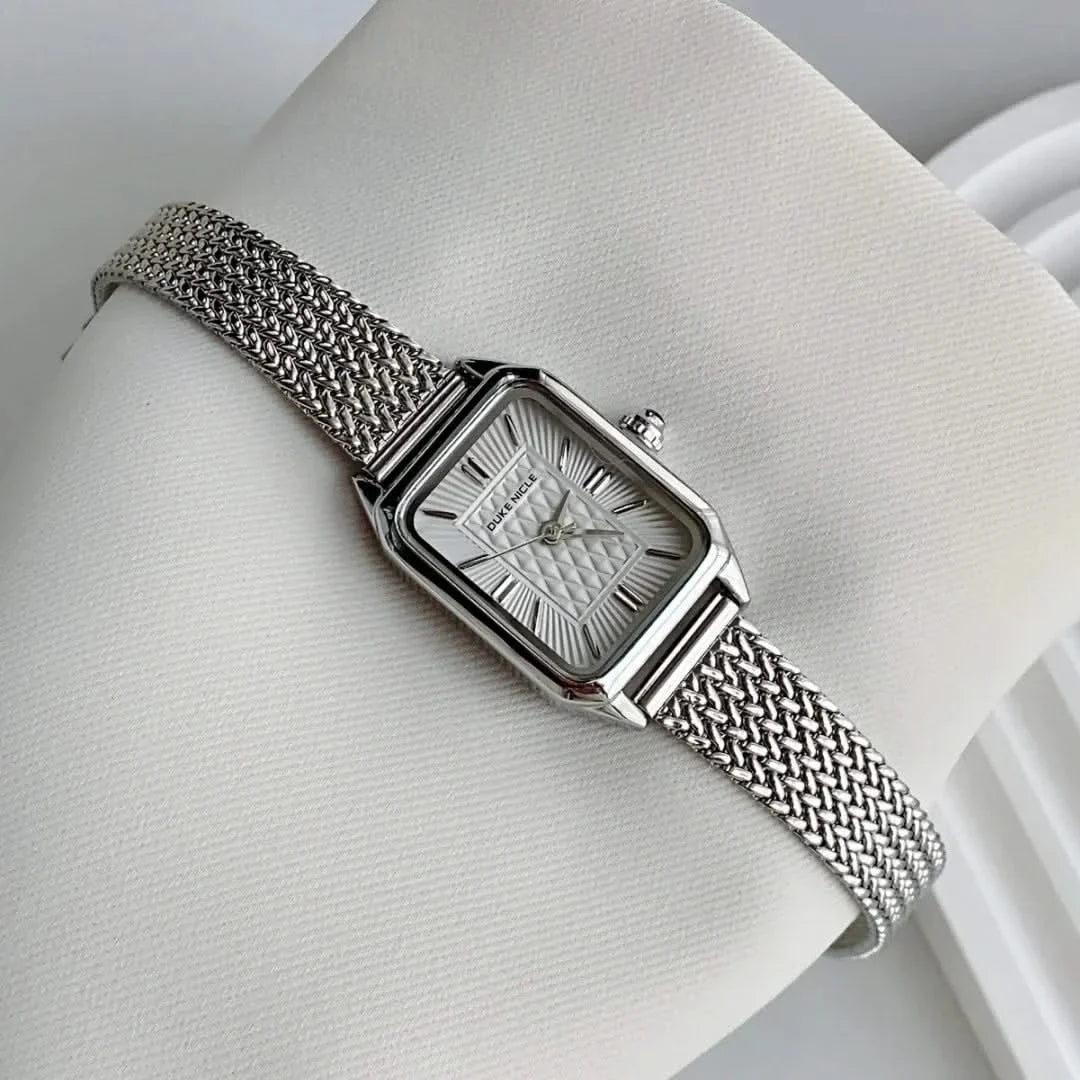 Petite women's dainty stainless steel watch, elegant and sleek fashion accessory.