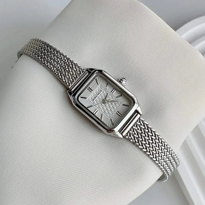 Petite women's dainty stainless steel watch, elegant and sleek fashion accessory.