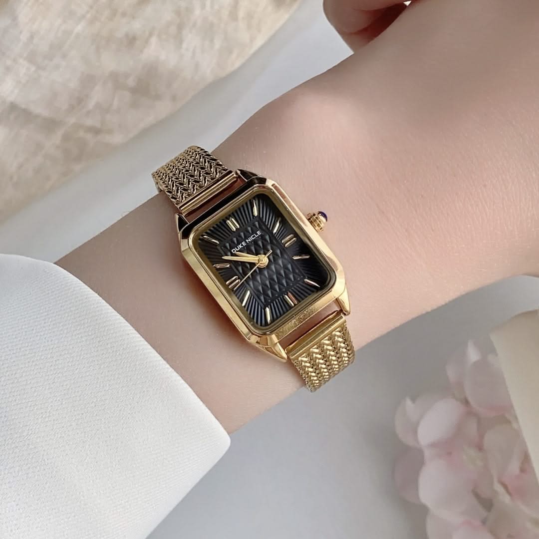 Elegant women's stainless steel wristwatch, sleek and modern fashion timepiece.