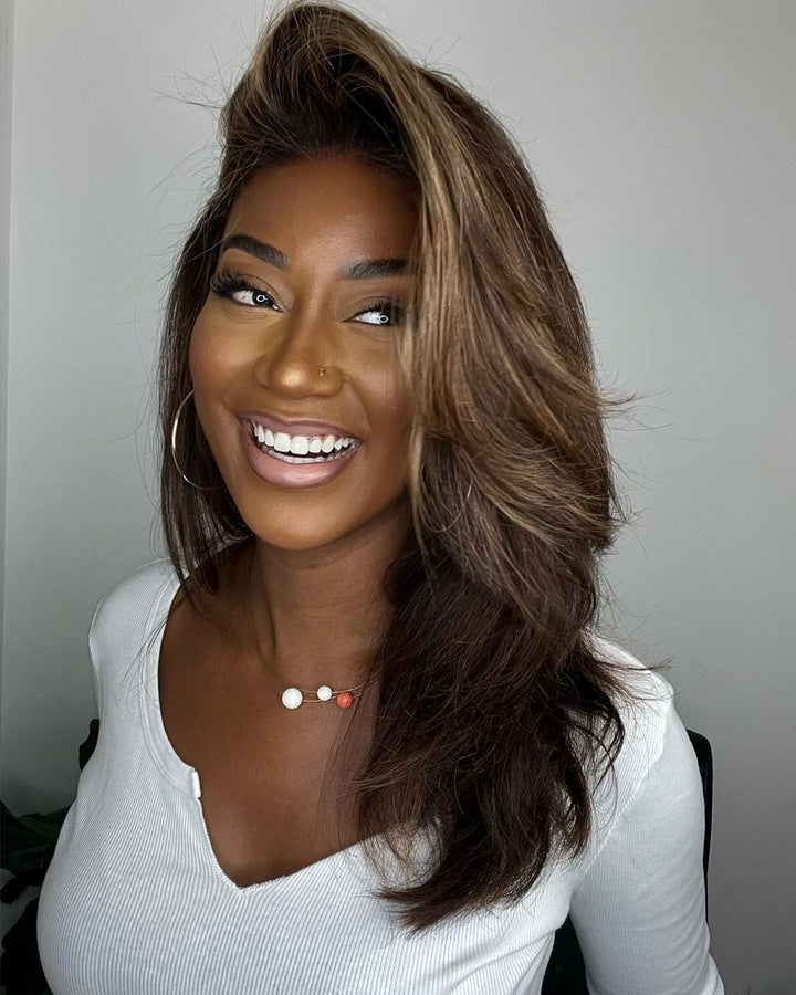 Women's wavy human hair lace front wig, dark brown with blonde highlights, features a natural pre-plucked hairline.