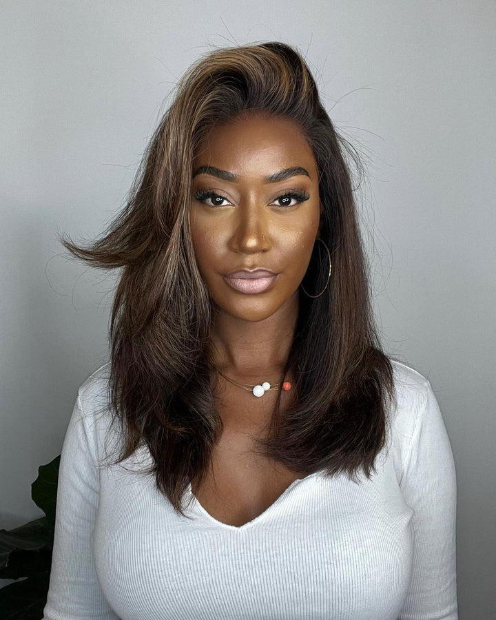 Elegant wavy highlighted lace front wig for women. Dark brown human hair with blonde accents, natural hairline, full density.