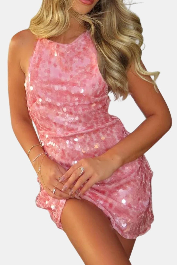Sparkling pink sequin halter mini dress. A stunning bodycon homecoming or cocktail party dress for women.