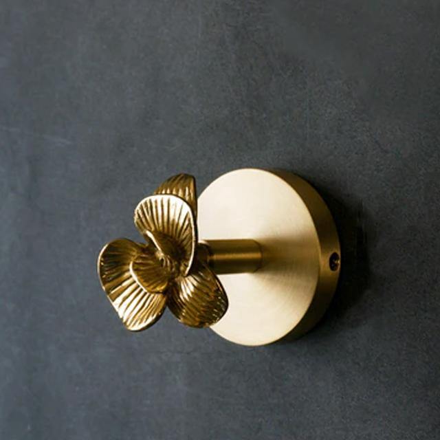 Gold finish decorative animal coat hook for hanging coats & adding elegance to walls.