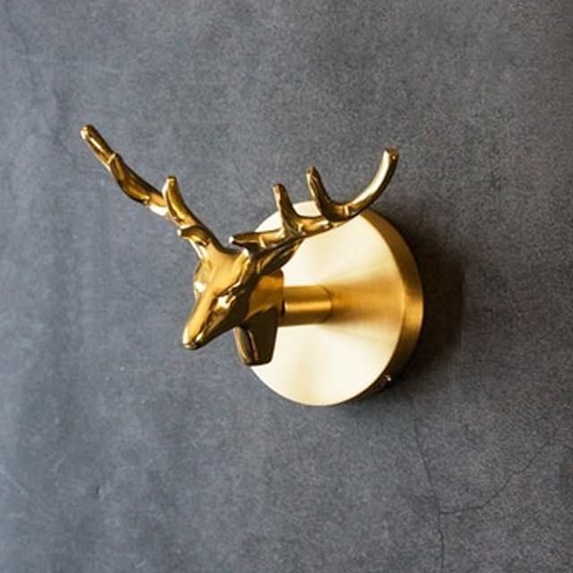 Stunning gold animal wall hook, a decorative coat hanger and unique home decor gift idea.