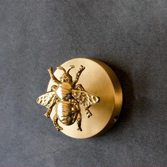 Gold finish animal hook, perfect for coats, towels, or bags. Elegant wall decor accessory.