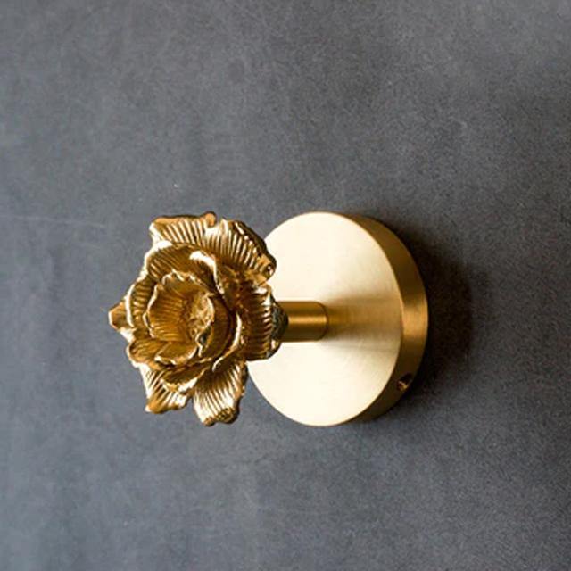 Sophisticated gold animal wall hook, an elegant decorative coat hanger for luxury home interiors.