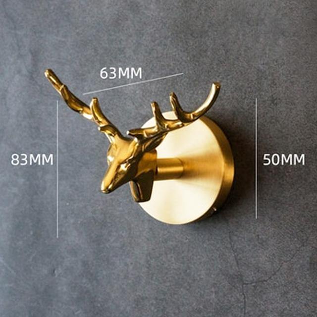 Elegant gold animal coat hook. Functional wall decor & luxury home accessory for coats & bags.
