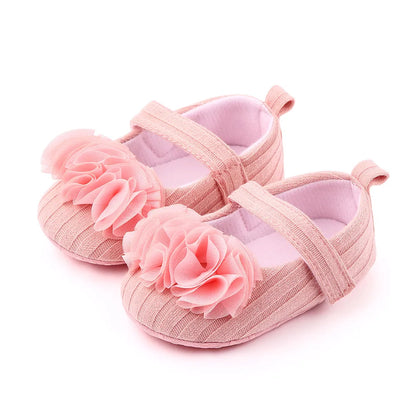 Soft sole baby shoes with floral cotton fabric for girls, suitable for indoor and outdoor play.